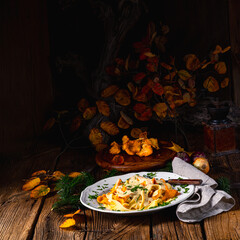 Tagliatelle with fresh chanterelles in a mushroom sauce