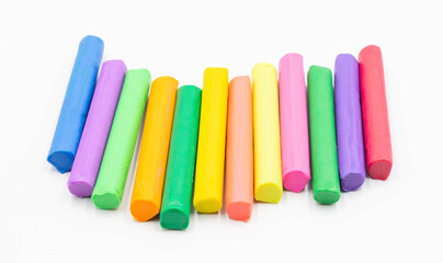 multi colors of plasticine sticks on white