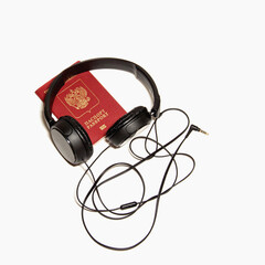 International biometric passport of a citizen of the Russian Federation and headphones with a wire. Isolated on a white background