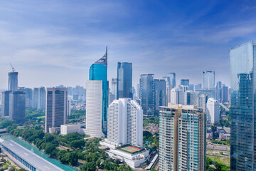 Fototapeta premium Modern highrise buildings at misty morning