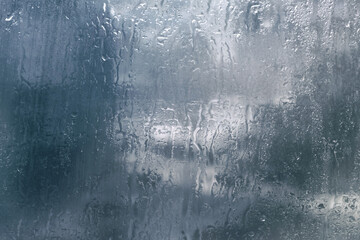 Raindrops on the glass. Background. Rainy weather, foggy glass.