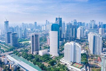 Naklejka premium Aerial view of highrise buildings at misty morning