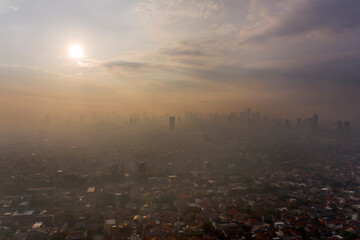 Beautiful Jakarta city with dense housing at sunset