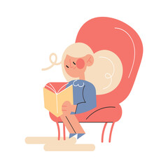 Happy small girl sitting at home and reading book in armchair