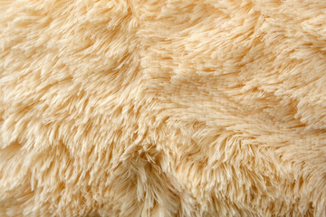 yellow texture of long wool close-up carpet. background. fluffy fur for designers, close-up.