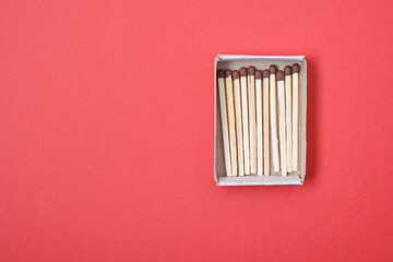 matches box on a red background top view