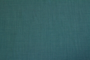 The background is textured denim dark green color for the autumn and winter wardrobe. Horizontal orientation