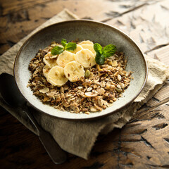 Traditional homemade granola with fresh banana