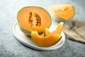 Fresh honey melon on a white plate