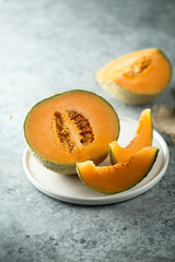 Fresh honey melon on a white plate