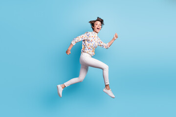Fototapeta na wymiar Full length profile side photo of young crazy girl happy smile run jump speed scream sale isolated over blue color background