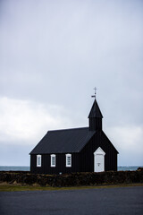 Fototapeta na wymiar Black Búðakirkja Church in Iceland on a cloudy day