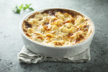 Homemade cauliflower gnocchi casserole with cheese