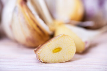 Cut a slice of fresh garlic close-up. Healthy organic food, vitamins, natural products, natural background