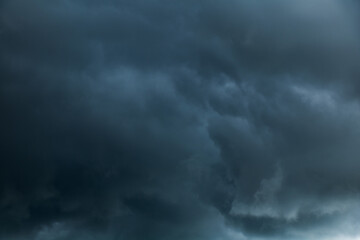 Naklejka na ściany i meble Dark blue Gloomy sky with stormy clouds