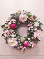 christmas wreath with pink flowers. New year decoration