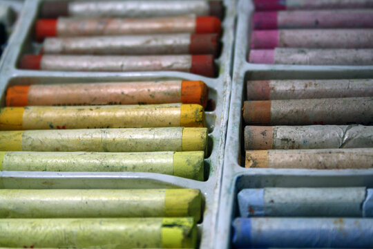 Pastel for drawing, arranged by color in sections of a box