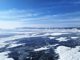 Frozen lake baikal, tourist trip in winter on baikal