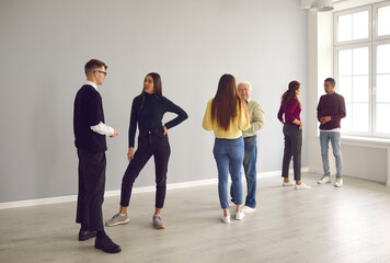 People standing in pairs and getting to know each other in group therapy session