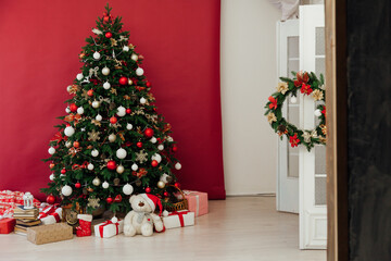 Fototapeta na wymiar Christmas tree interior with decor gifts for the new year