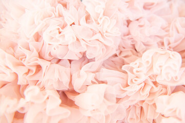Background of fatin pink color twisted fabric. Abstract background. Selective Focus.