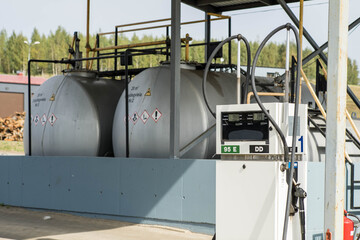 Huge fuel storage tanks. Bio gas station with a gas pump.