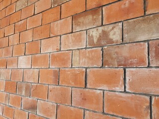 Brick wall with orange brick.Orange brick background.