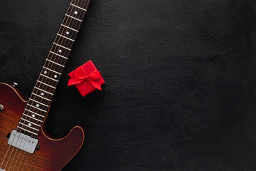 Christmas music. Flat lay composition with guitar and fir tree branches 