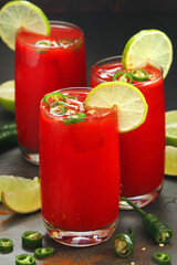 Jalapeno tomato margarita cocktail with lime