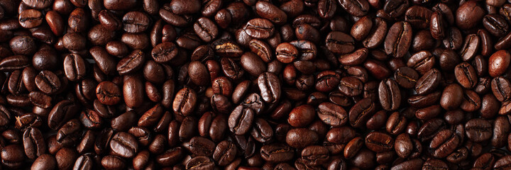 Coffee beans banner background top view. Coffe beans surface.