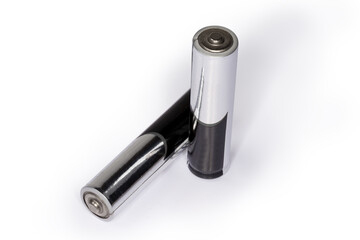 Alkaline AAA batteries on white background, close-up, selectibe focus