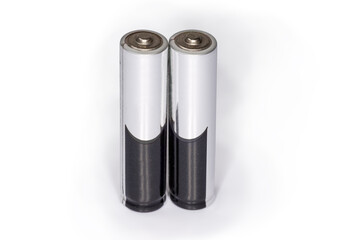 Alkaline AAA batteries on a white background close-up