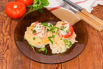 Serving cooked pasta nests with chopped meat on rustic table