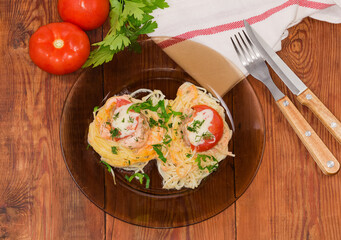 Cooked pasta nests with chopped meat on dish, top view