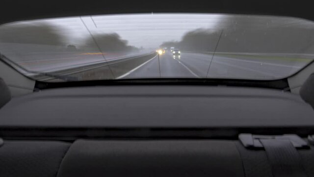 Wet rainy weather on a UK motorway timelapse with cars and trucks