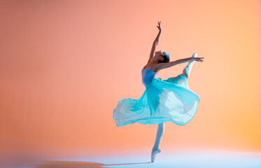 Ballerina in a light dress is dancing on colored background with backlight