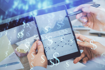 Double exposure of man's hands holding and using a phone and financial chart drawing. Market analysis concept.