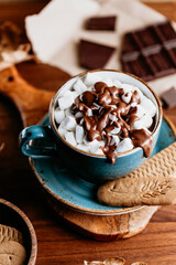 Close-up of hot chocolate with marshmallows on the table. Autumn or winter cozy still life.