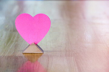 Pink wood hearts are on the wooden table and copy space,Valentines day ideas
