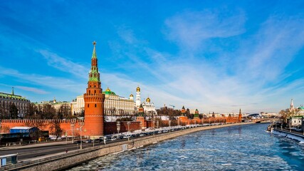 Obraz premium The Moscow Kremlin, the Kremlin Embankment, the Moskva River in the early spring during the ice drift. Russia.