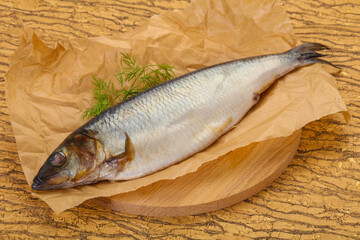 Salted herring over the wooden board