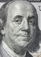 Portrait of Benjamin Franklin on a 100 dollars bill