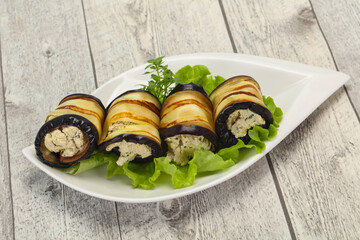 Stuffed eggplant roll with cheese and herbs