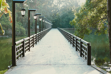 bridge across pond lake in park