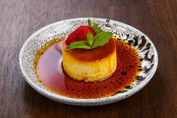 Panna cota with syrope and strawberry
