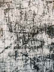 Layers of vintage posters glued and torn with time to the wall