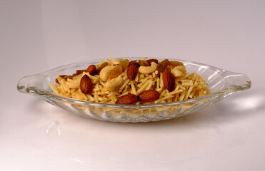 Indian style deep fried snacks falahari chivda- chivda or mixture namkeen with dry fruits.