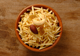 Indian style deep fried snacks falahari chivda- chivda or mixture namkeen with dry fruits.