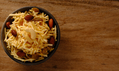 Indian style deep fried snacks falahari chivda- chivda or mixture namkeen with dry fruits.