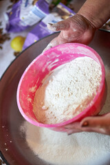 Sifting flour with sieve